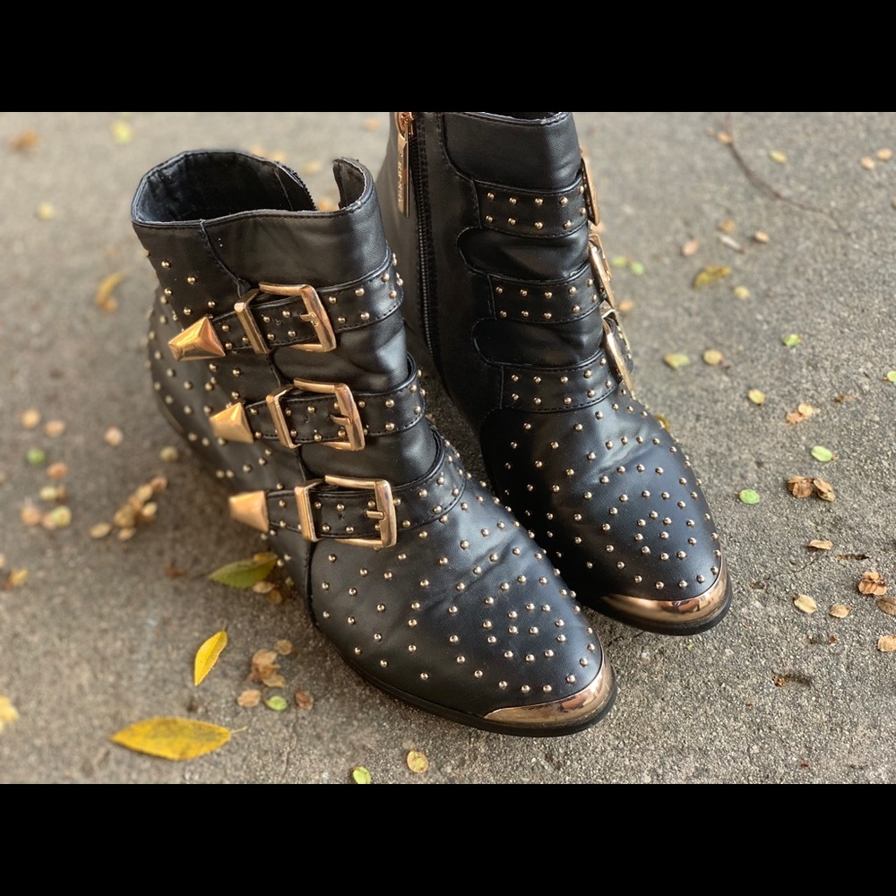 Ankle boots with Gold-toned buckles and studs.
